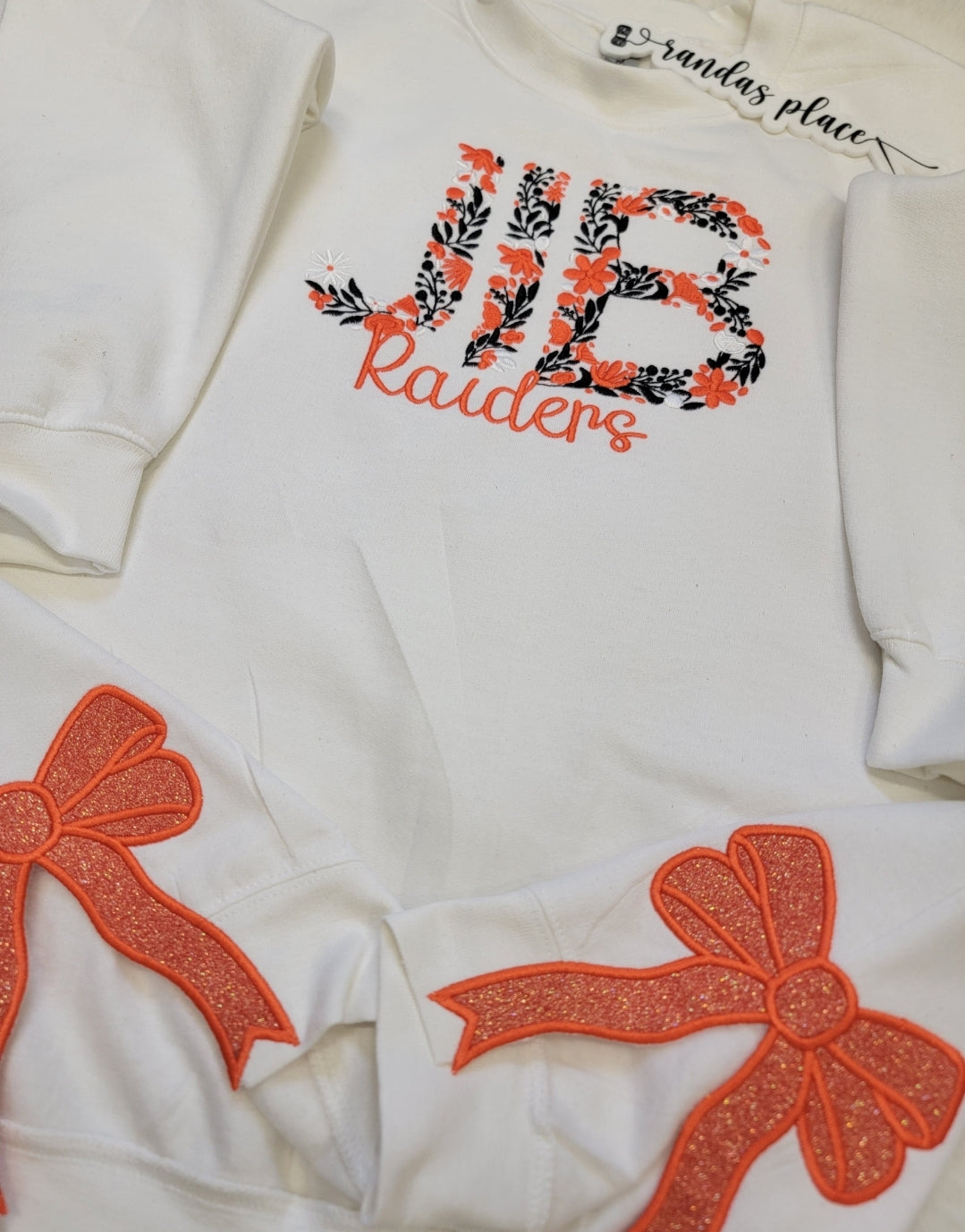 JIB Raiders Floral Bow Crewneck