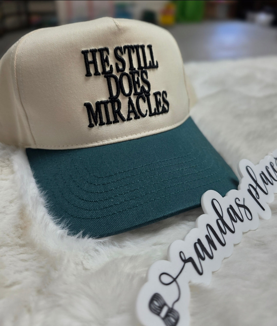 He Still Does Miracles Trucker Hat