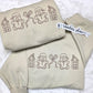 Cozy Gingerbread Village Embroidered Crewneck