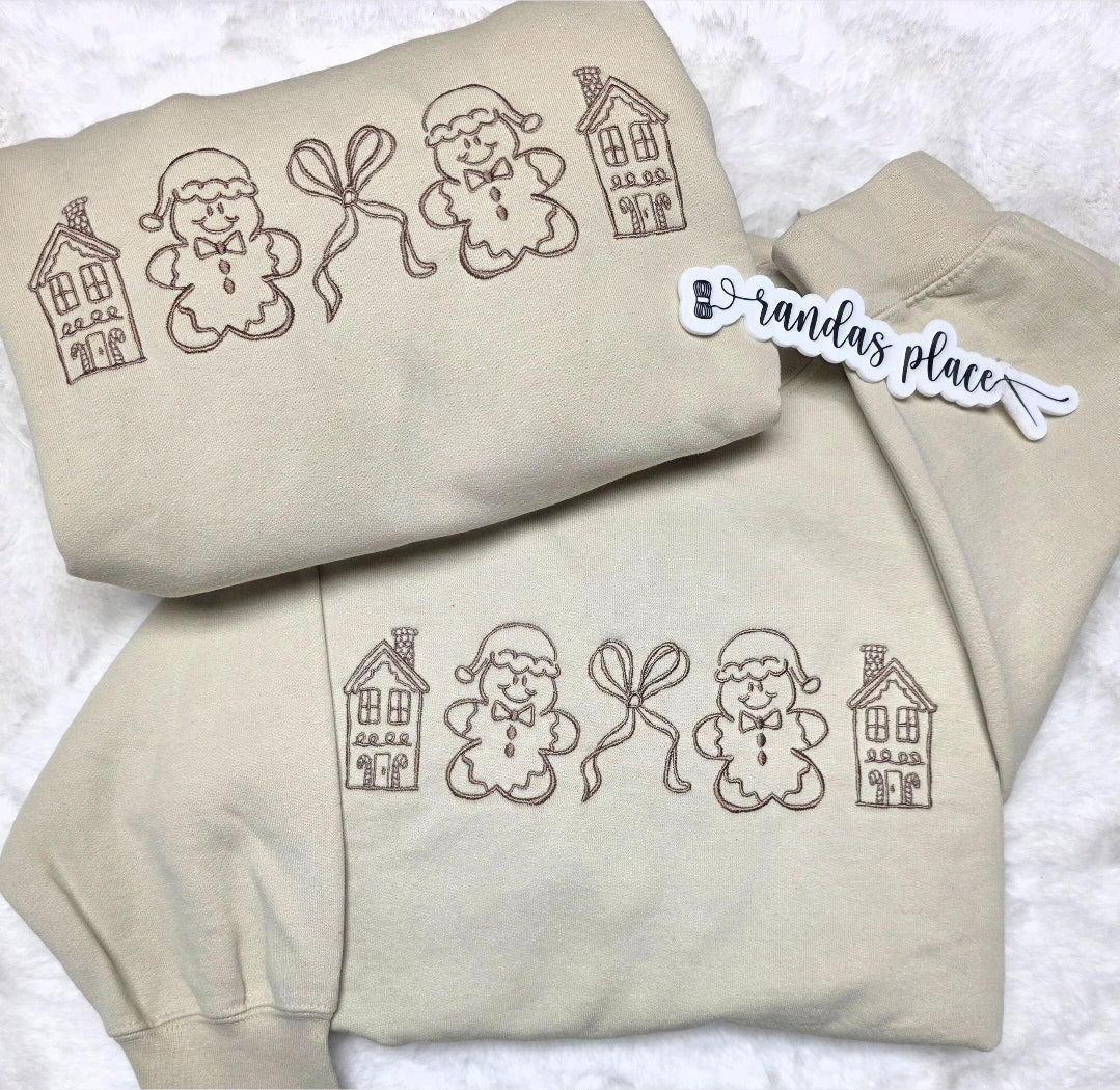 Cozy Gingerbread Village Embroidered Crewneck
