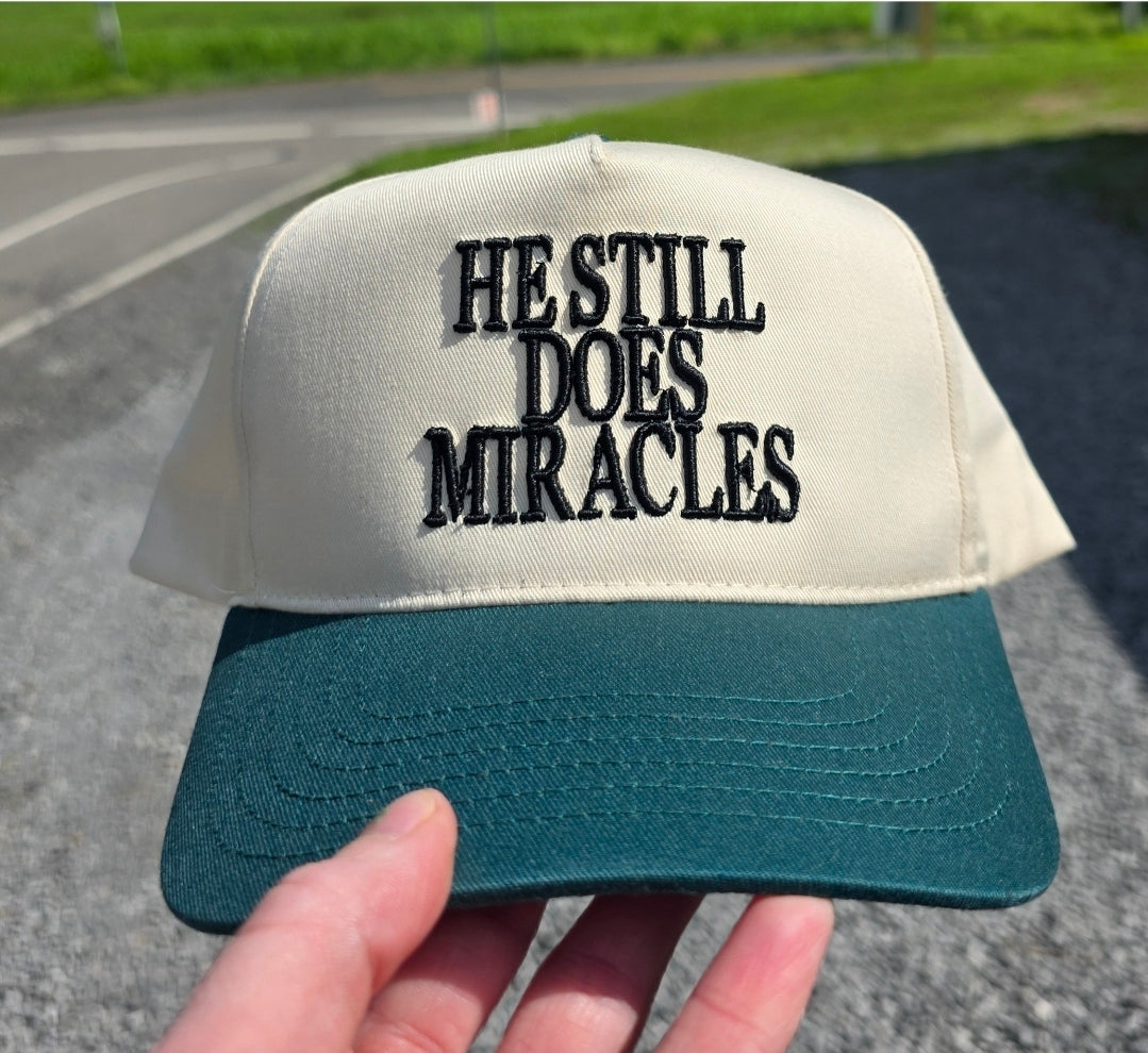 He Still Does Miracles Trucker Hat